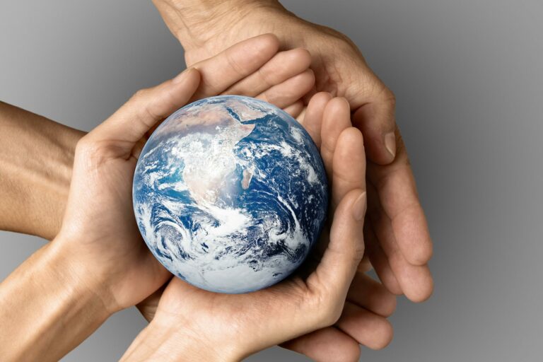 people-holding-earth-their-hands